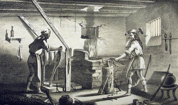 A monochrome drawing depicting female blacksmiths working in a forge, a dark skinned one working the bellows, a light skinned one at the forge.